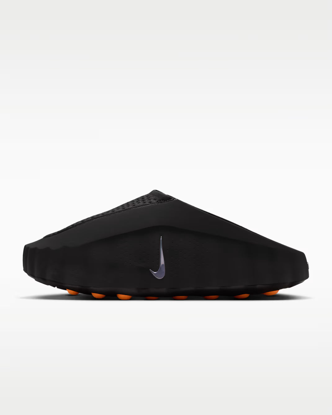 Black sandal with orange sole on a white background